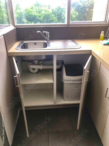 Photography A sink of a kitchen in a hotel room.