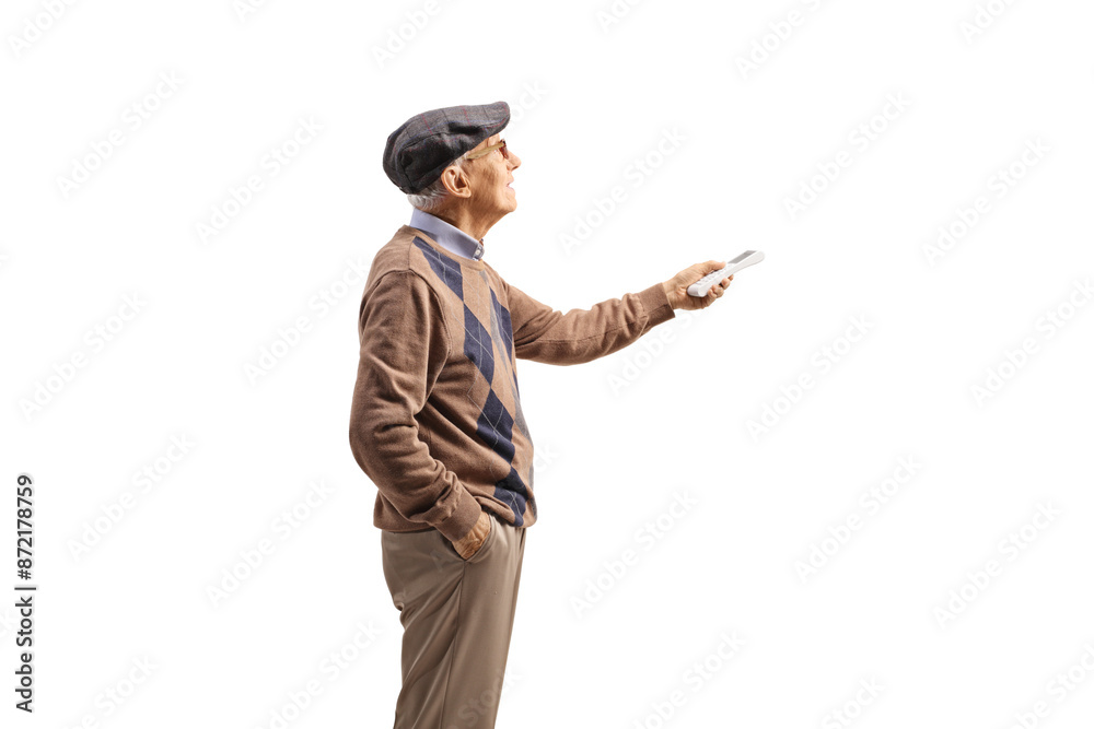 Elderly man holding a remote controller for air conditioner Elderly man holding a remote controller for air conditioner