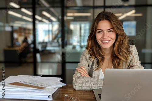 Happy busy mature business woman entrepreneur in office using laptop at work, smiling professional middle aged female company executive manager working looking at computer at workplace
