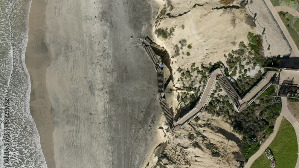 Aerial view of staircase leading to beach on a suny day in San Diego California 