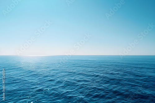 Tranquil Blue Seascape: A Peaceful Ocean Meets Blue Sky Reflecting Sunlit Waves