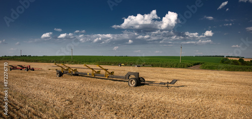 Trolley for seeders, winnowers. Field work. Harvesting environment in central Ukraine. Wheat fields.

