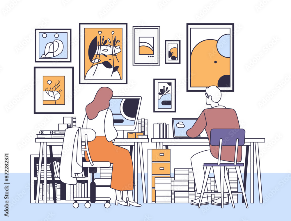 Two people working in a home office artistic workspace organized desks colorful framed art minimalist Two people working in a home office artistic workspace organized desks colorful framed art minimalist