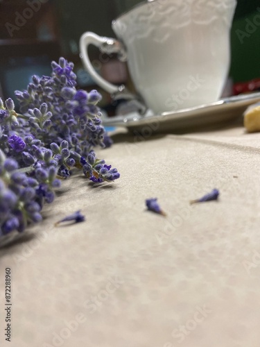 Lavender flowers close to a cup a tea