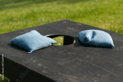 Cornhole bags on a cornhole board close up shot