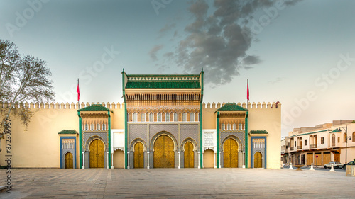 Canvas Print Fez, Morocco - March 23, 2024: Brass gate and zellige mosaic tilework on Dar al-