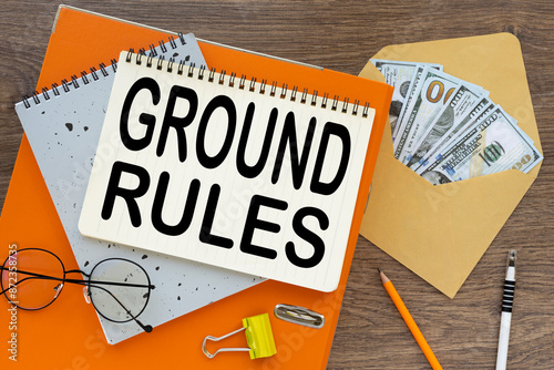 Ground rules text on a notepad on an orange folder