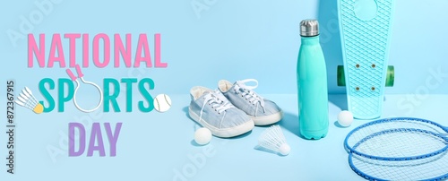 Bottle of water, sports equipment and shoes on light blue background. Banner for National Sports Day photo