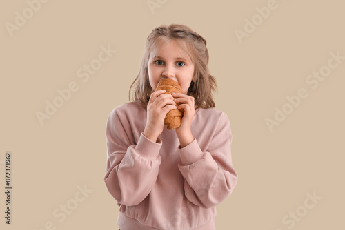 Cute little girl with crois...