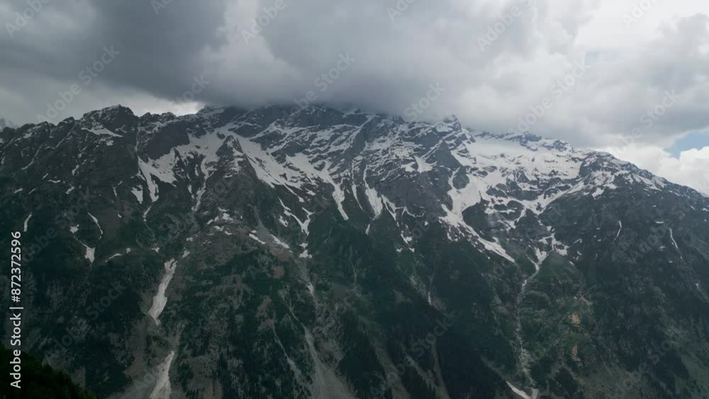 Flight over the peaks of the Swat Valley with spruce slopes and snow capped peaks. Flight over the peaks of the Swat Valley with spruce slopes and snow capped peaks.