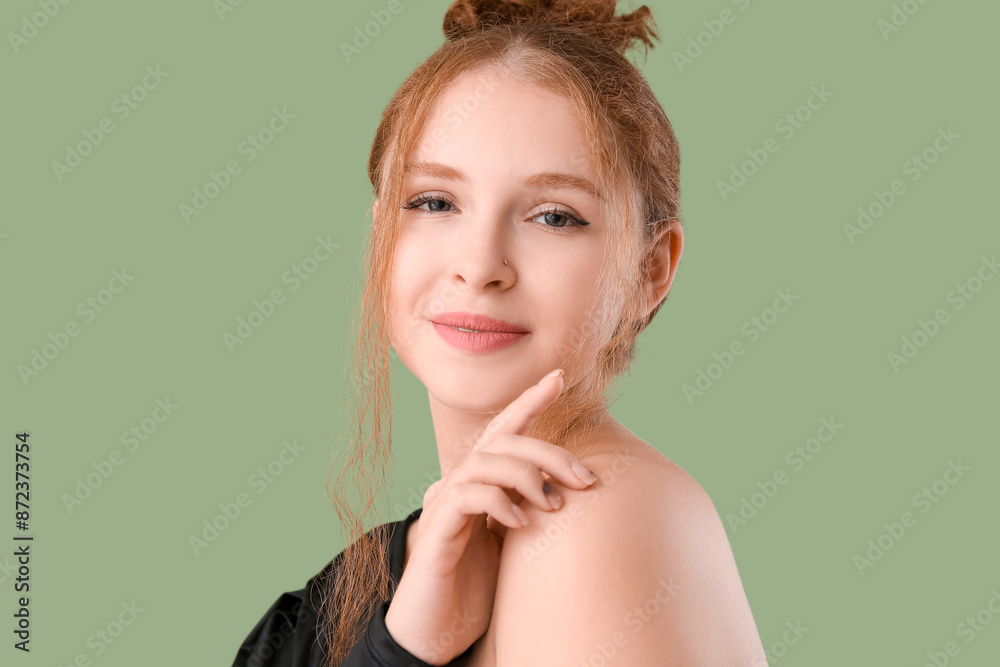 Portrait of pretty redhead woman on green background Portrait of pretty redhead woman on green background
