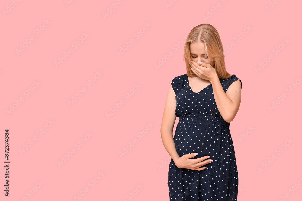Beautiful unhappy young pregnant woman on pink background Beautiful unhappy young pregnant woman on pink background