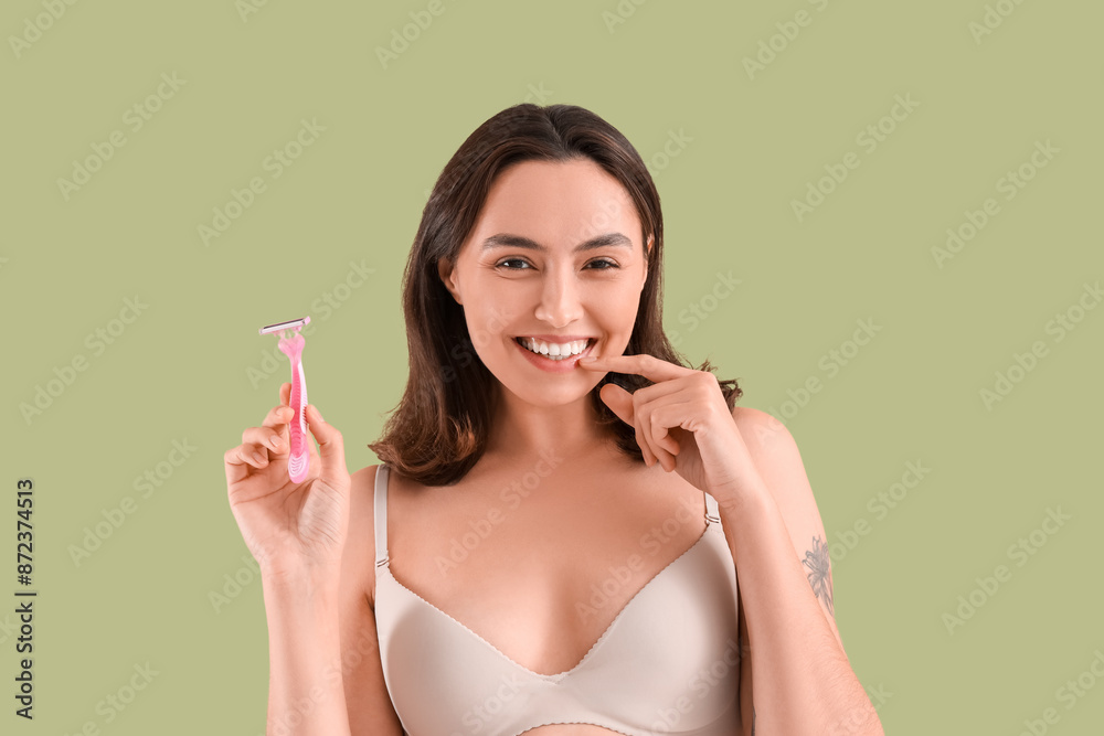 Beautiful young happy woman with razor on green background Beautiful young happy woman with razor on green background