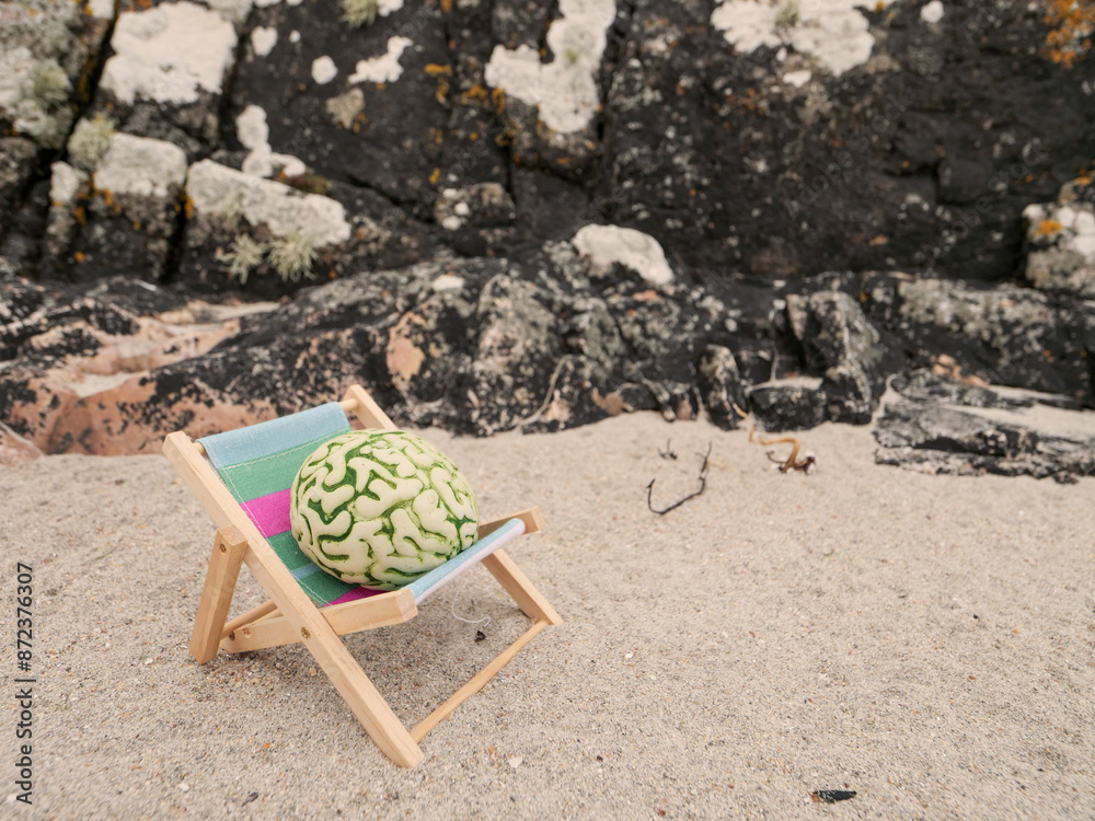 A brain is on a sun lounger bed in a calm nature environment. Relaxation of mind concept with help of fresh air and beautiful scenery. Time for a break theme. Avoid burn out measure A brain is on a sun lounger bed in a calm nature environment. Relaxation of mind concept with help of fresh air and beautiful scenery. Time for a break theme. Avoid burn out measure