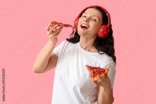 Happy young woman in headph...
