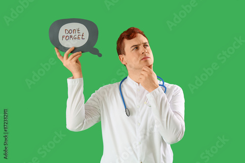 Thoughtful doctor holding s...