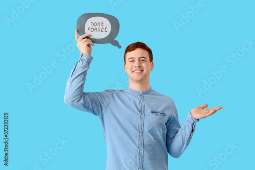 Young man holding speech bu...