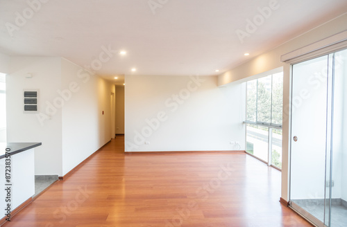 apartment living room with bay window and hardwood floor