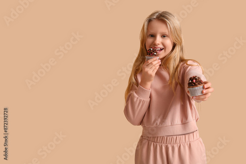 Cute little girl eating tas...