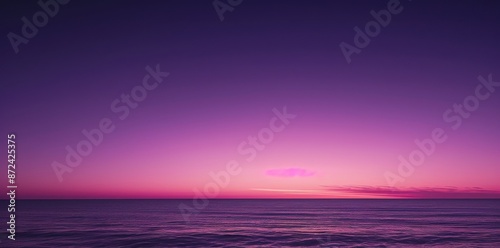 Peaceful Purple Sunset Over the Ocean with Calm Waves.