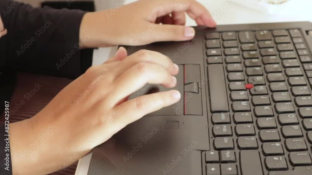 Female hand moving the laptop touchpad. The video was taken close up Female hand moving the laptop touchpad. The video was taken close up
