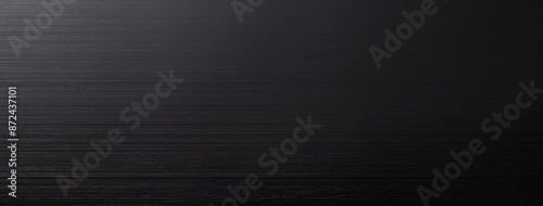 暗い色味のステンレス板の背景テクスチャー