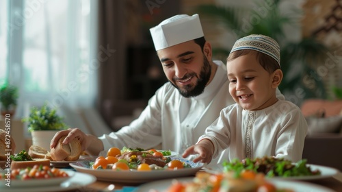 Ramadan Dinner: Muslim Father Passing Lafah Bread to Son at Dining Table photo