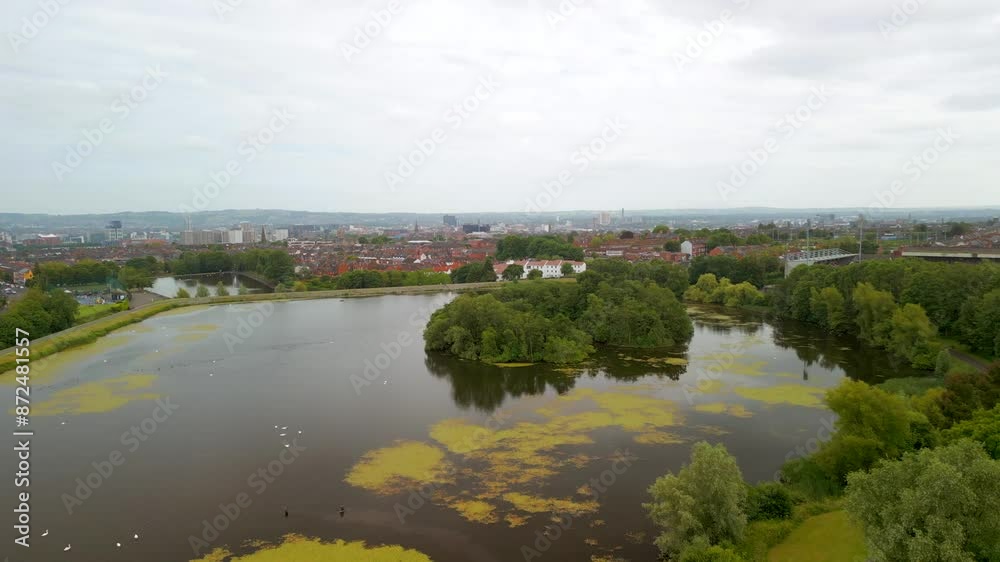 Aerial shot of the Belfast Waterworks in North Belfast, Northern Ireland.
The camera moves forwards and passes over trees and water.
Filmed in 4K, 60 frames per second and in Rec709 color space. Aerial shot of the Belfast Waterworks in North Belfast, Northern Ireland.
The camera moves forwards and passes over trees and water.
Filmed in 4K, 60 frames per second and in Rec709 color space.