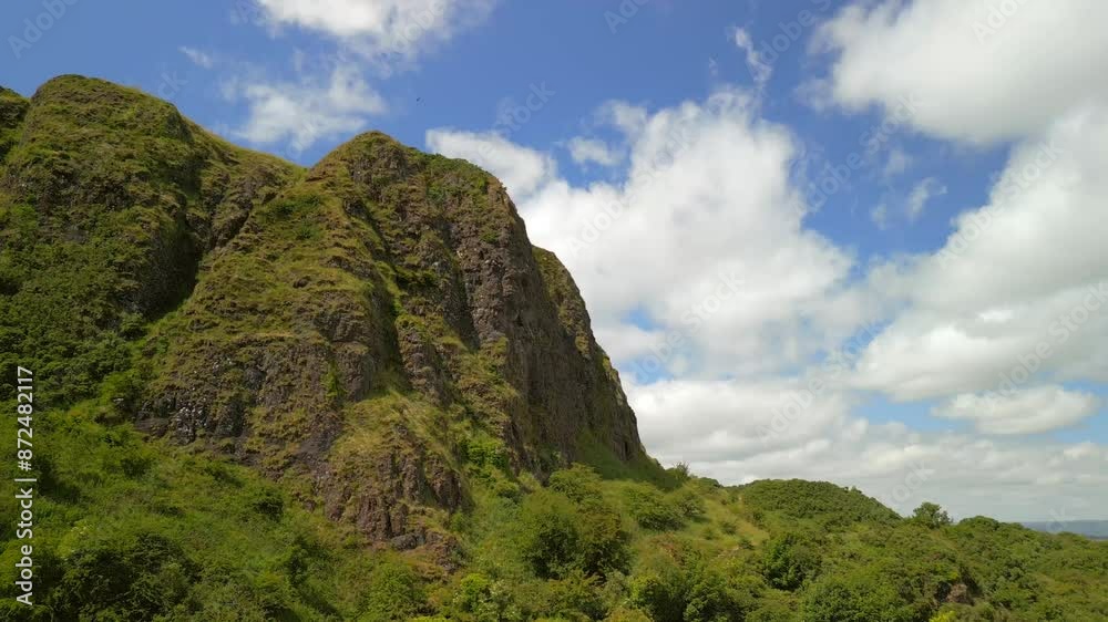 Aerial shot of Cavehill, Belfast on a sunny day.
The camera begins close to the peak and rises up to show it's tip.
Filmed in 4K, 60fps and in Rec709 color space. Aerial shot of Cavehill, Belfast on a sunny day.
The camera begins close to the peak and rises up to show it's tip.
Filmed in 4K, 60fps and in Rec709 color space.