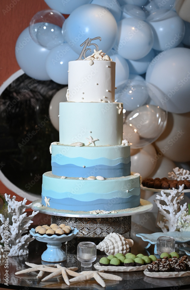 Fototapeta premium party room, birthday cake,table decoration, reception table, cake and sweet table, theme party, birthday party, cake with sea shells, maritime theme, 15th birthday party, a lot of balloons 