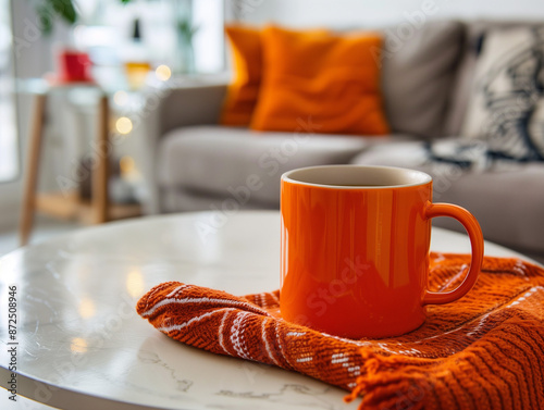 A Pink coffee or tea cup putting on white table in minimal bright room, with cozy sunlight. photo