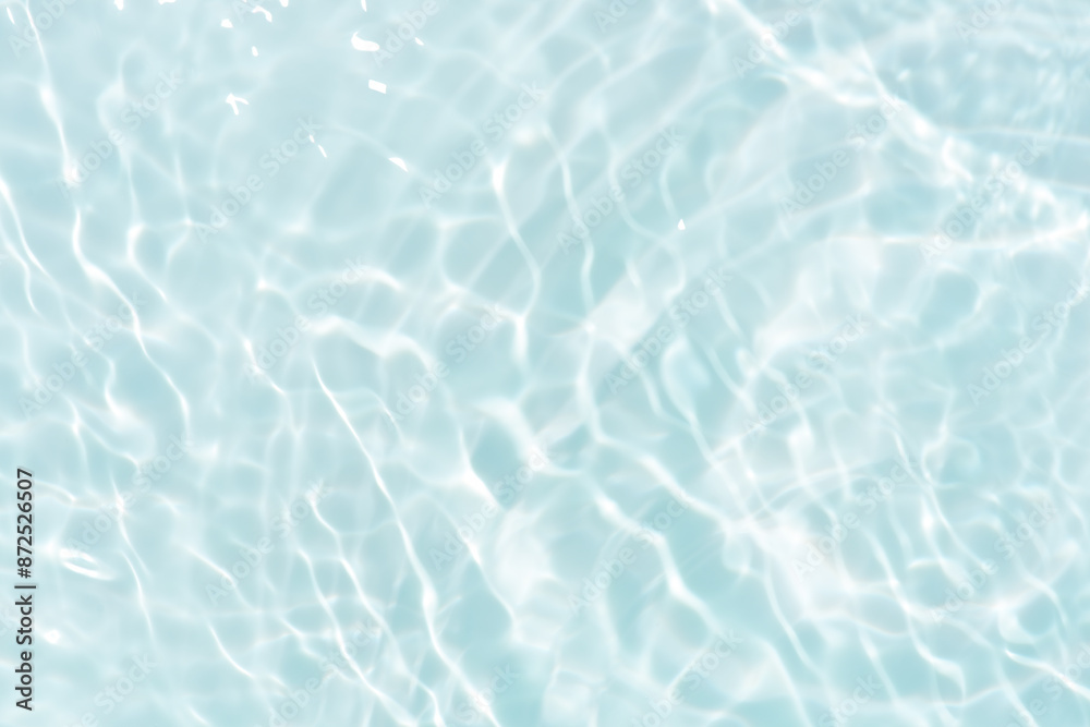 Blue water with ripples on the surface. Defocus blurred transparent blue colored clear calm water surface texture with splashes and bubbles. Water waves with shining pattern texture background. Blue water with ripples on the surface. Defocus blurred transparent blue colored clear calm water surface texture with splashes and bubbles. Water waves with shining pattern texture background.