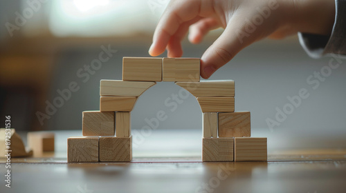 Child Building Wooden Arch with Toy Blocks