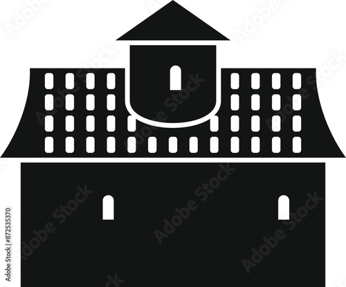 Black silhouette of a medieval building with tower and tiled roof
