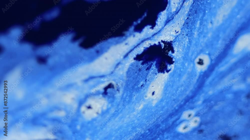 Glitter ink spill. Paint flow. Blur blue black color sparkling particles texture liquid emulsion blend wave abstract art background. Glitter ink spill. Paint flow. Blur blue black color sparkling particles texture liquid emulsion blend wave abstract art background.