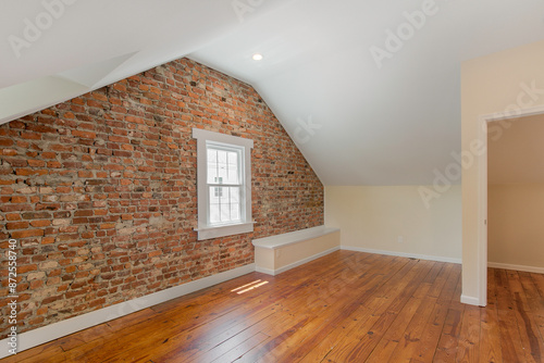 Loft Hardwood Floor, Exposed Brick Wall, Window, And Ceiling photo