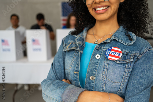 Cuadro en lienzo close up on a 2024 vote pin button of a young African American woman smiling at a US election polling station