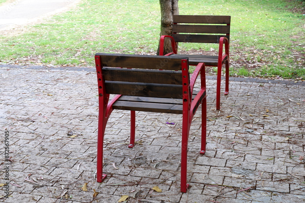 A lounge chair stands on the sidewalk on a street in a big city. A lounge chair stands on the sidewalk on a street in a big city.