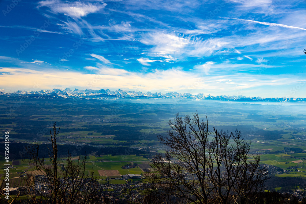 Swiss Alps seen from over 100 kilometers from hike trail to Hallhopfli peak in Switzerland