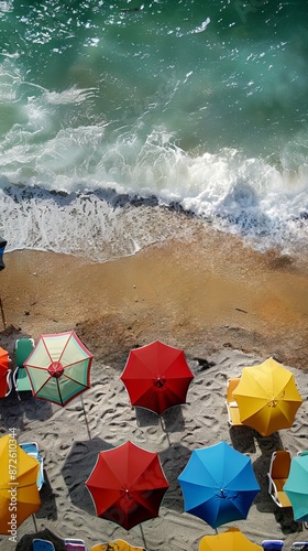 Aerial view of tropical beach scene in summer with beach umbrellas, beach chairs and the sea