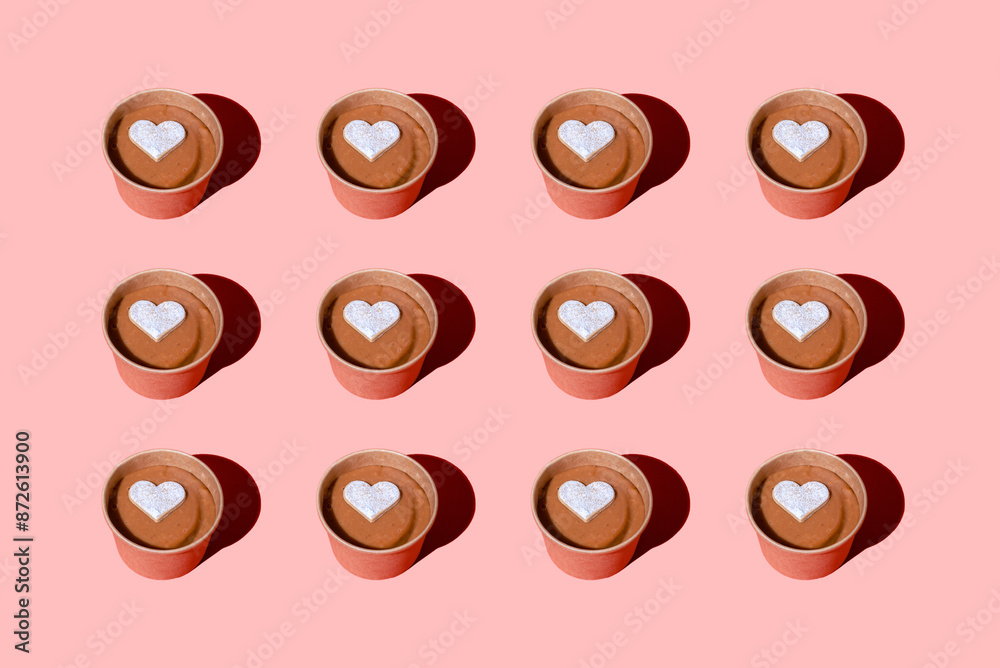 Colorful of dulce de leche pattern on pastel pink background. Colorful of dulce de leche pattern on pastel pink background.