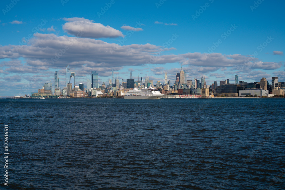 Manhattan's beautiful skyline, New York, United States. Panorama view of New York city skyline in Midtown Manhattan. USA NYC. American big city. Lower Manhattan skyline. Manhattan's beautiful skyline, New York, United States. Panorama view of New York city skyline in Midtown Manhattan. USA NYC. American big city. Lower Manhattan skyline.