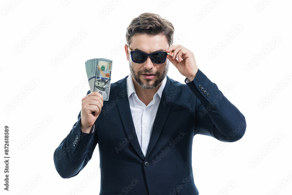 Man with money cash. Dollar banknotes. Portrait of businessman holding money banknotes. Dollar bills, credit, online banking. Rich man pointing at dollar banknotes, bank loan, financial savings. Man with money cash. Dollar banknotes. Portrait of businessman holding money banknotes. Dollar bills, credit, online banking. Rich man pointing at dollar banknotes, bank loan, financial savings.