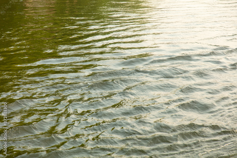 The surface of the water in the river as an abstract background. Texture The surface of the water in the river as an abstract background. Texture