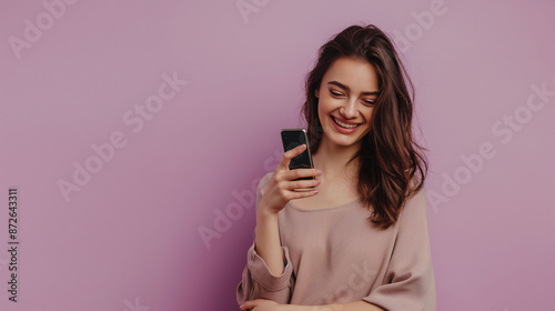 Portrait of a smiling young woman using smart phone