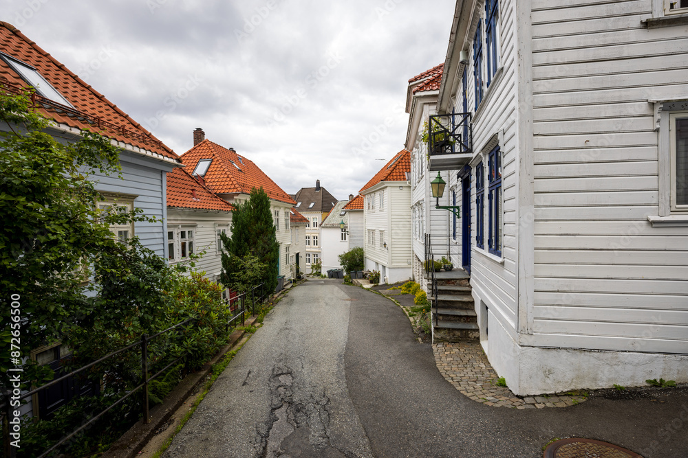 Charming old town street with old wooden buildings in Bergen, Norway Charming old town street with old wooden buildings in Bergen, Norway