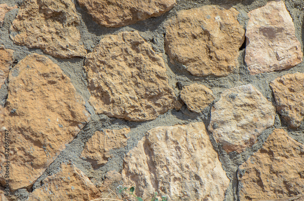 Fototapeta premium Wall of stones as a texture for background