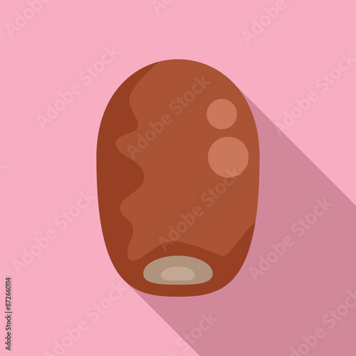 Single dried date fruit is lying on a pink background, offering a minimalist perspective on this sweet and chewy treat