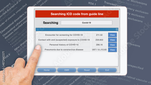 Someone searching for disease code using computer application on electronic tablet.