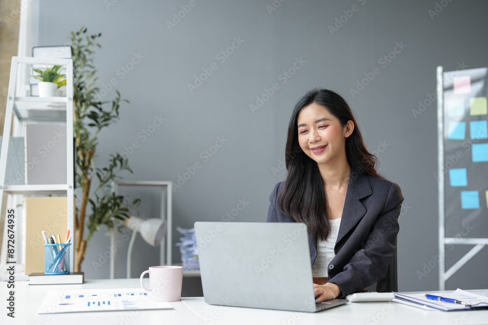 Asian businesswoman working with laptop computer at modern office Work and type Search for information on the internet online at your desk in the office working lifestyle concept. Asian businesswoman working with laptop computer at modern office Work and type Search for information on the internet online at your desk in the office working lifestyle concept.